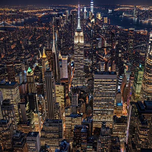 A shadow standing in the city at midnight